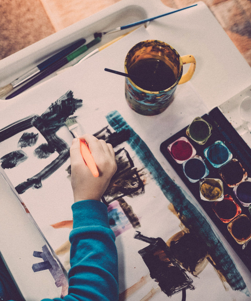 A child painting with watercolors as part of an arts education program supported by RockLock’s Giving Back initiative. RockLock partners with NYC organizations to empower underrepresented communities and provide creative opportunities for young New Yorkers.