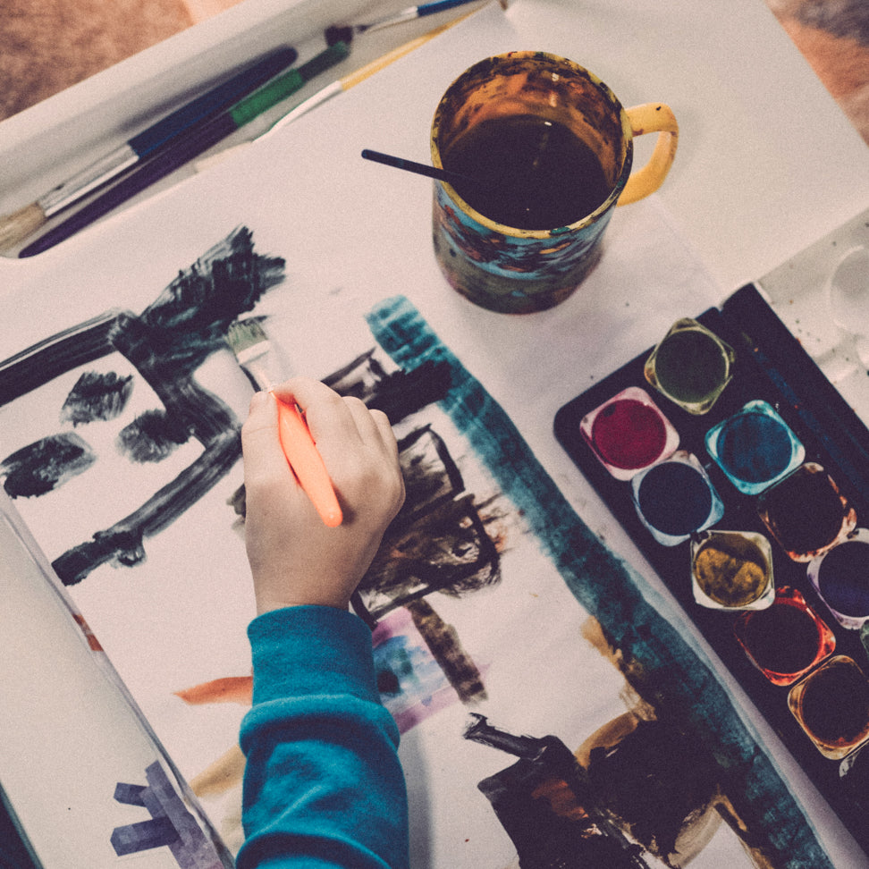 A child painting with watercolors as part of an arts education program supported by RockLock’s Giving Back initiative. RockLock partners with NYC organizations to empower underrepresented communities and provide creative opportunities for young New Yorkers.